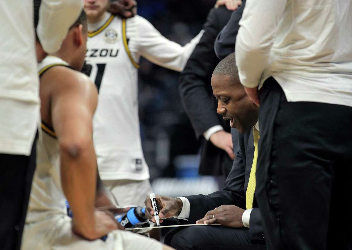 Missouri head coach Dennis Gates draws up a play as the Tigers play the Utah State Aggies in an NCAA Tournament first round game at Golden 1 Center in Sacramento on Thursday.