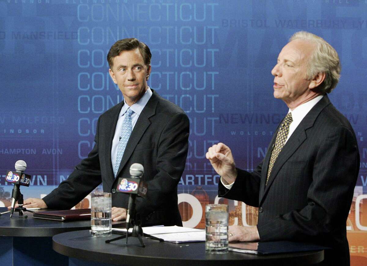 Challenger Ned Lamont, left, listens to U.S. Sen. Joe Lieberman (D-Conn.) during a debate in Hartford on July 6, 2006, in advance of the Democratic primary.