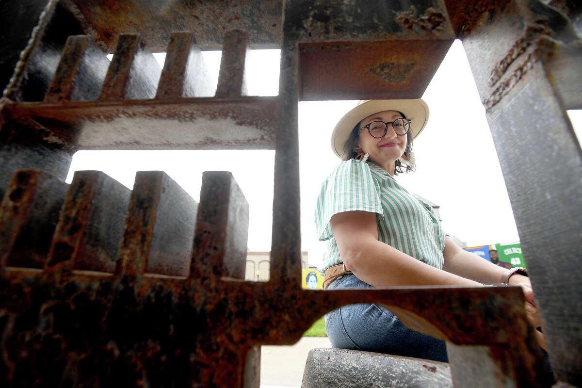 Sophia Bouey poses outside the Art Museum of Southeast Texas which is one of he spots near and dearest to her heart. Photo made Thursday, March 16, 2023 Kim Brent/Beaumont Enterprise