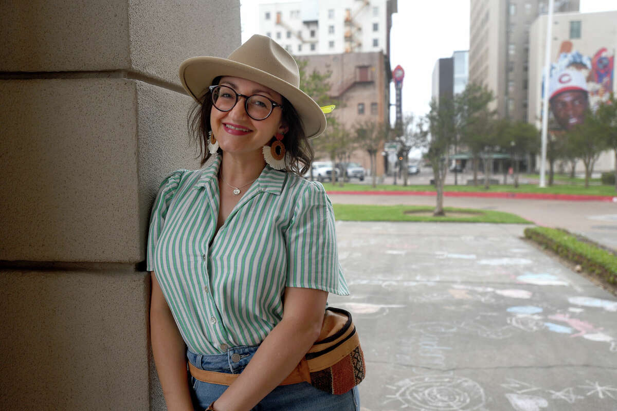 Sophia Bouey poses outside the Art Museum of Southeast Texas which is one of he spots near and dearest to her heart. Photo made Thursday, March 16, 2023 Kim Brent/Beaumont Enterprise