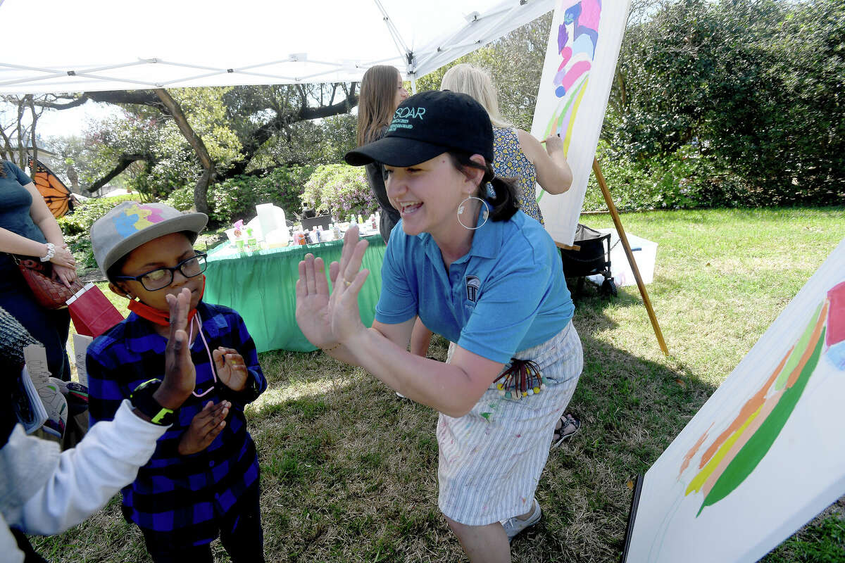 Sophia Bouey helps in the painting station during the first of the McFaddin-Ward House Museum's month-long SOAR events. Photo made Saturday, March 4, 2023 Kim Brent/Beaumont Enterprise