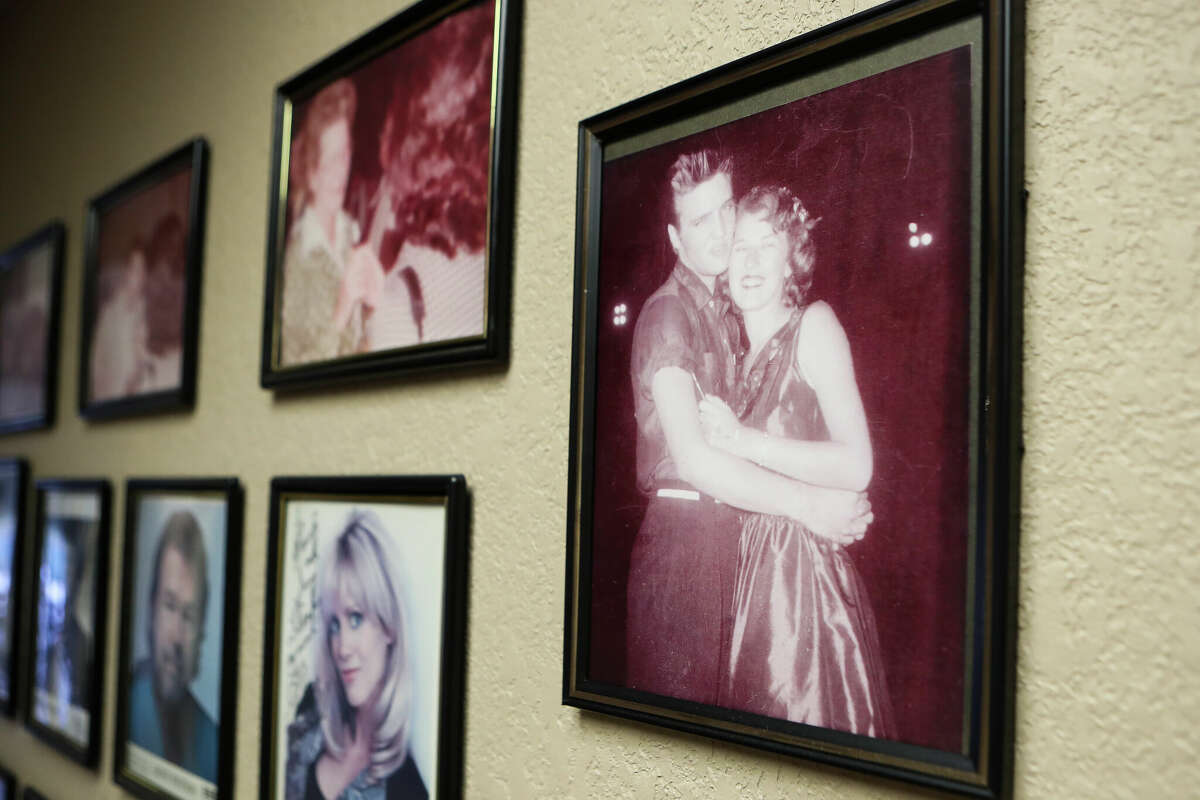 An image of radio DJ Mary McCoy and Elvis Presley during his 1955 visit to Conroe hangs on the wall of the KSTAR Radio building along with other signed images to McCoy from country music legends, Wednesday, March 1, 2023, in Montgomery.