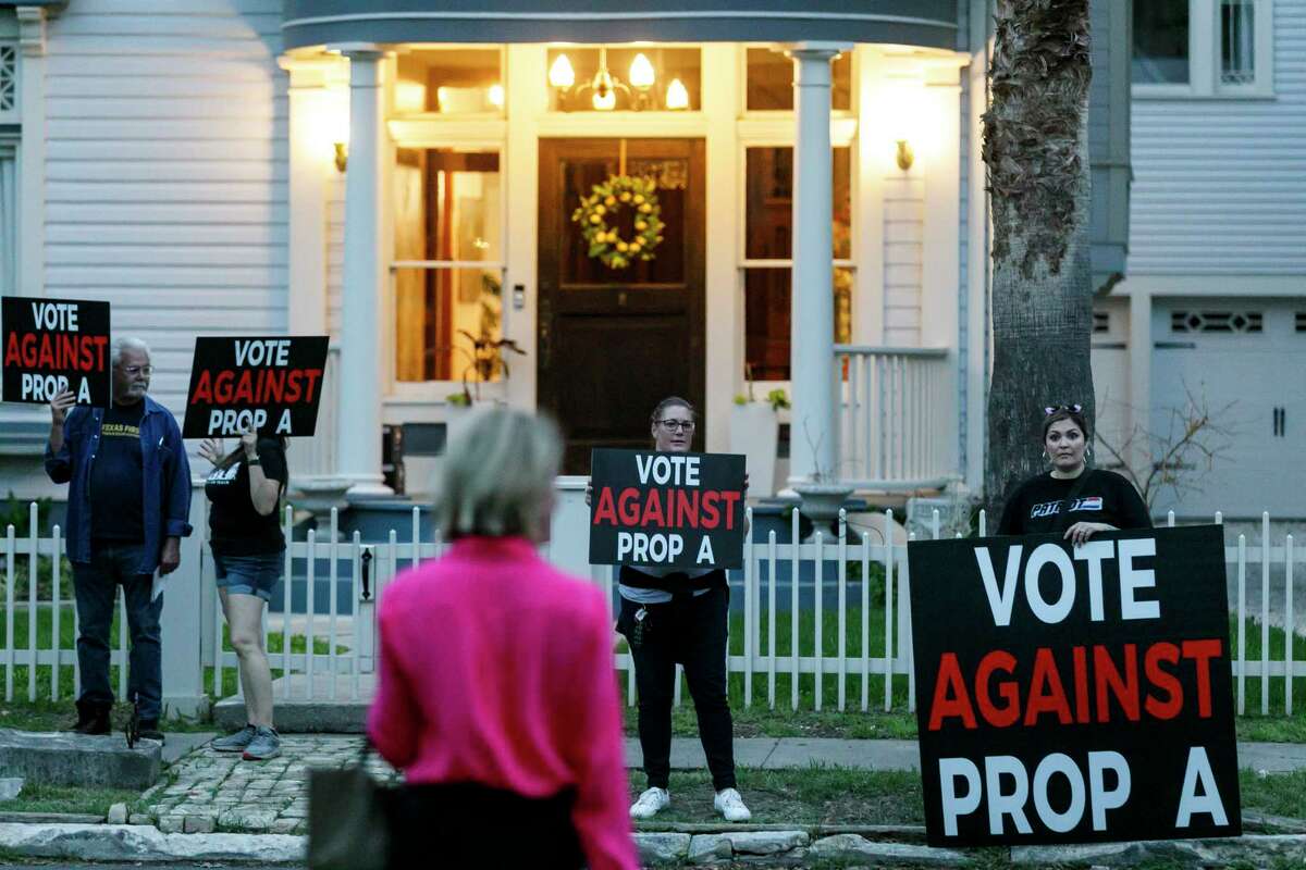 People protest outside of the campaign launch party for the San Antonio Justice Charter in San Antonio, Texas, Thursday, March 16, 2023. The Justice Charter will appear as Proposition A on the May 6 city election ballot.