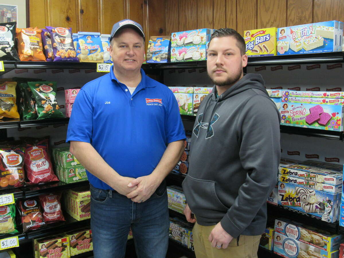 Joe Pence, left, and his son, Brad, opened the 2nd Generation Distribution, aka “The Little Debbie Store,” late last year in Roxana. The store specializes in wholesale Little Debbie products.