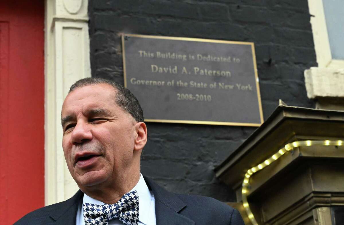 Former Gov. David A. Paterson attends the dedication of the Albany War Room Tavern building on Eagle Street, which was named in his honor on Friday during a ceremony. The restaurant and bar is located across from Albany Capital Center.