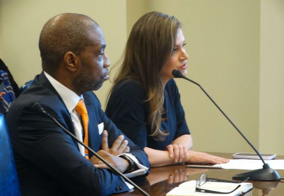 Former Colorado House Speaker Terrance Carroll (left) and elections expert Amber McReynolds testify to a House committee about the experience of Colorado and other states with ranked choice voting, a system in which voters rank candidates in order of preference rather than choosing just one.
