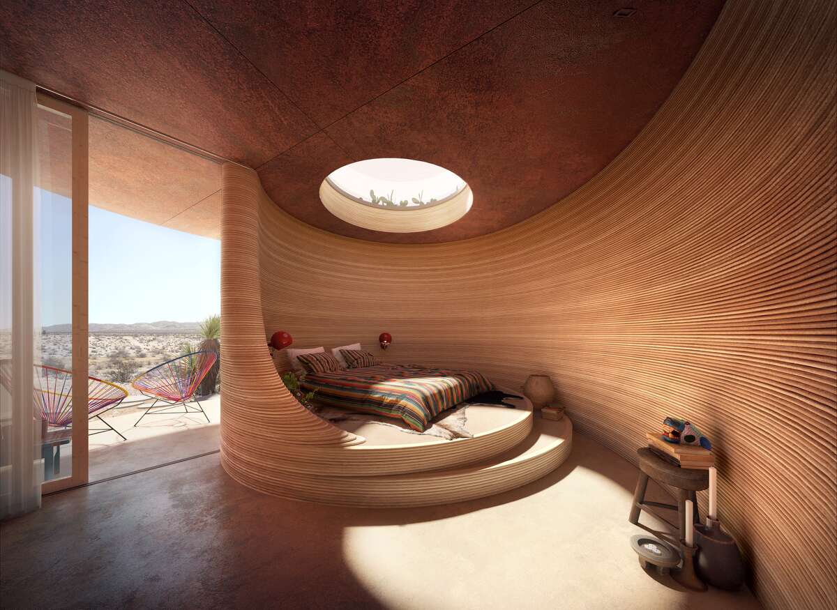 A 3-D printed room at the El Cosmico, featuring a raised bed platform, skylight, all built to match the hotel's high-desert surroundings. 