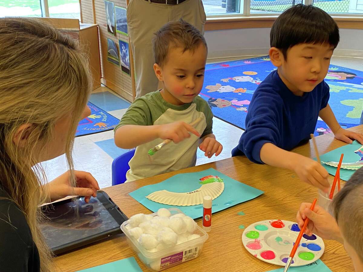 Young children work on art projects at the on-site day care facility at Boehringer Ingelheim in Ridgefield. 