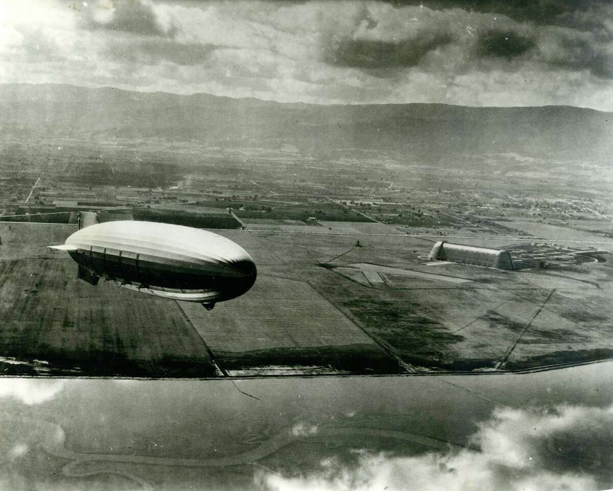 The U.S.S. Macon Navy airship flies over Moffett Field in an early 1930s photo.