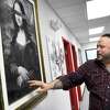 Johnny Cavanaugh, 45, of New Milford, a co-owner of Culture Club Gallery, talks about artwork by co-owner Richard Nigro of Danbury. Photo Friday, March 17, 2023.