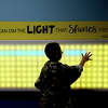 A boy lights up a board while passing through the play stations at the Beaumont Children's Museum, which had St. Patrick's Day themed activities throughout the day. Photo made Friday, March 17, 2023 Kim Brent/Beaumont Enterprise