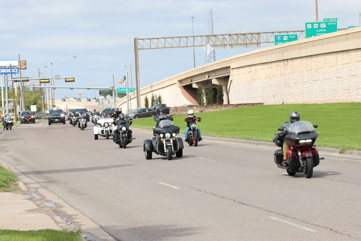 The motorcycle group Twistin’ Wrists for the Troops, which is comprised of Navy veterans, is escorted to Cowboy Harley-Davidson in Beaumont on Friday, March 17, 2023.