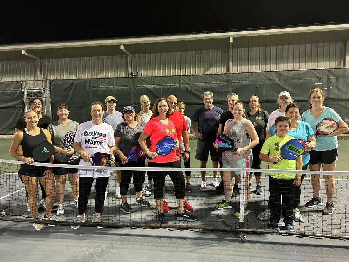 Members of the SETX pickballers group pose for a picture after an evening class. 