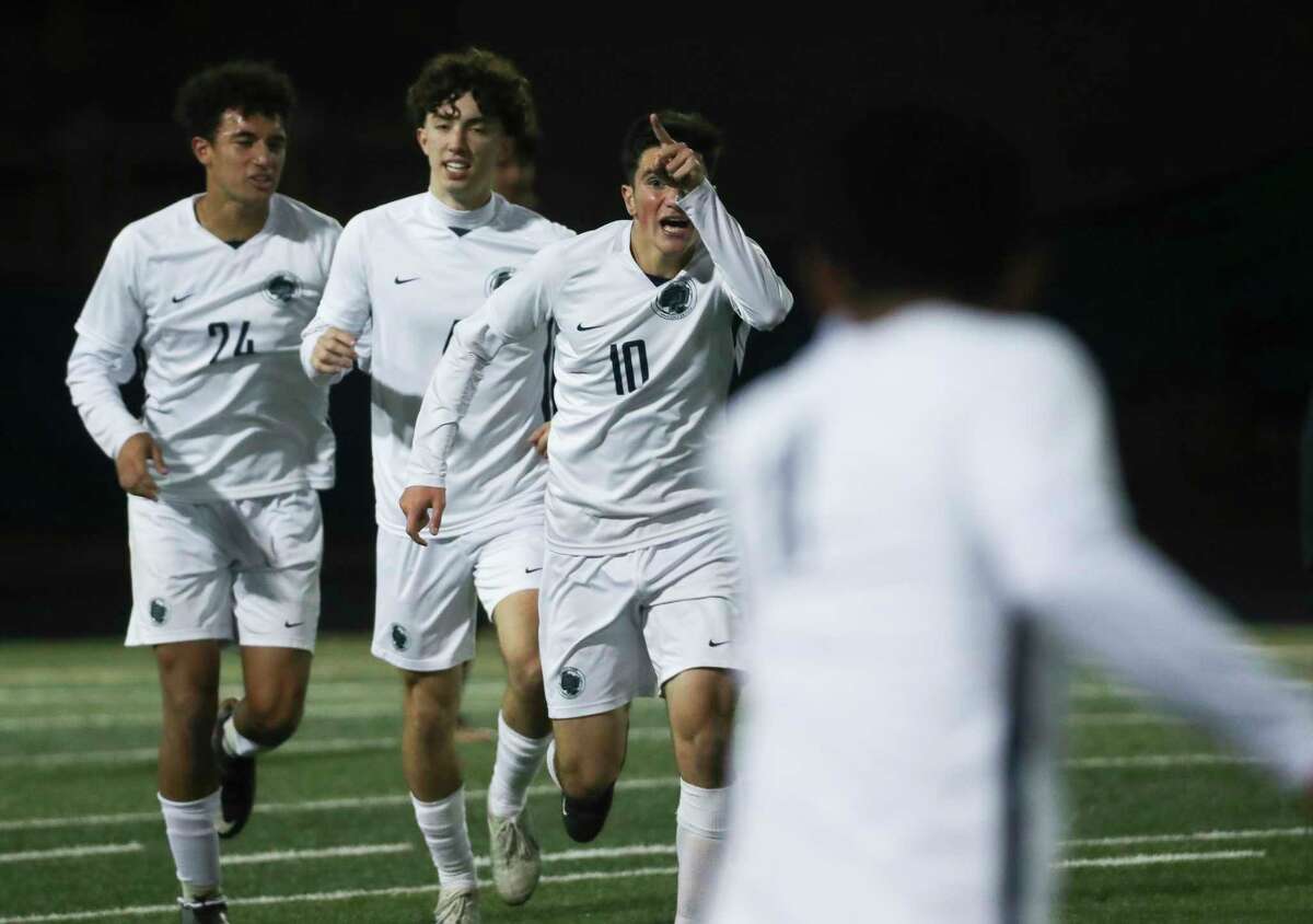 College Park's Alessio De Pippo (10) celebrates after scoring a goal to put the Cavaliers up 2-0 during the second half of a District 13-6A high school soccer match at Conroe High School, Friday, March 17, 2023, in Conroe.