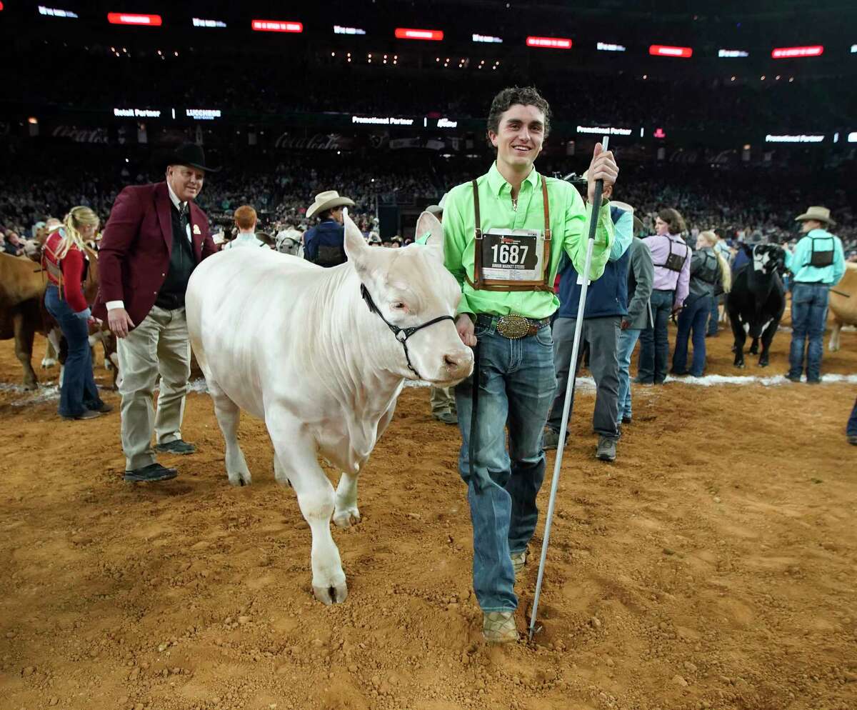 Stiles Patin reacts after his steer won Grand Champion during the Junior Market Steer Selection at the Houston Livestock Show and Rodeo at NRG Stadium on Friday, March 17, 2023 in Houston.