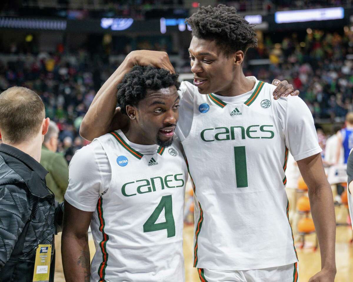 Miami sophomore Bensley Joseph, left, and Anthony Walker celebrate after beating Drake in the first round of the NCAA tournament on Friday, March 17, 2023, at the MVP Arena in Albany, NY.