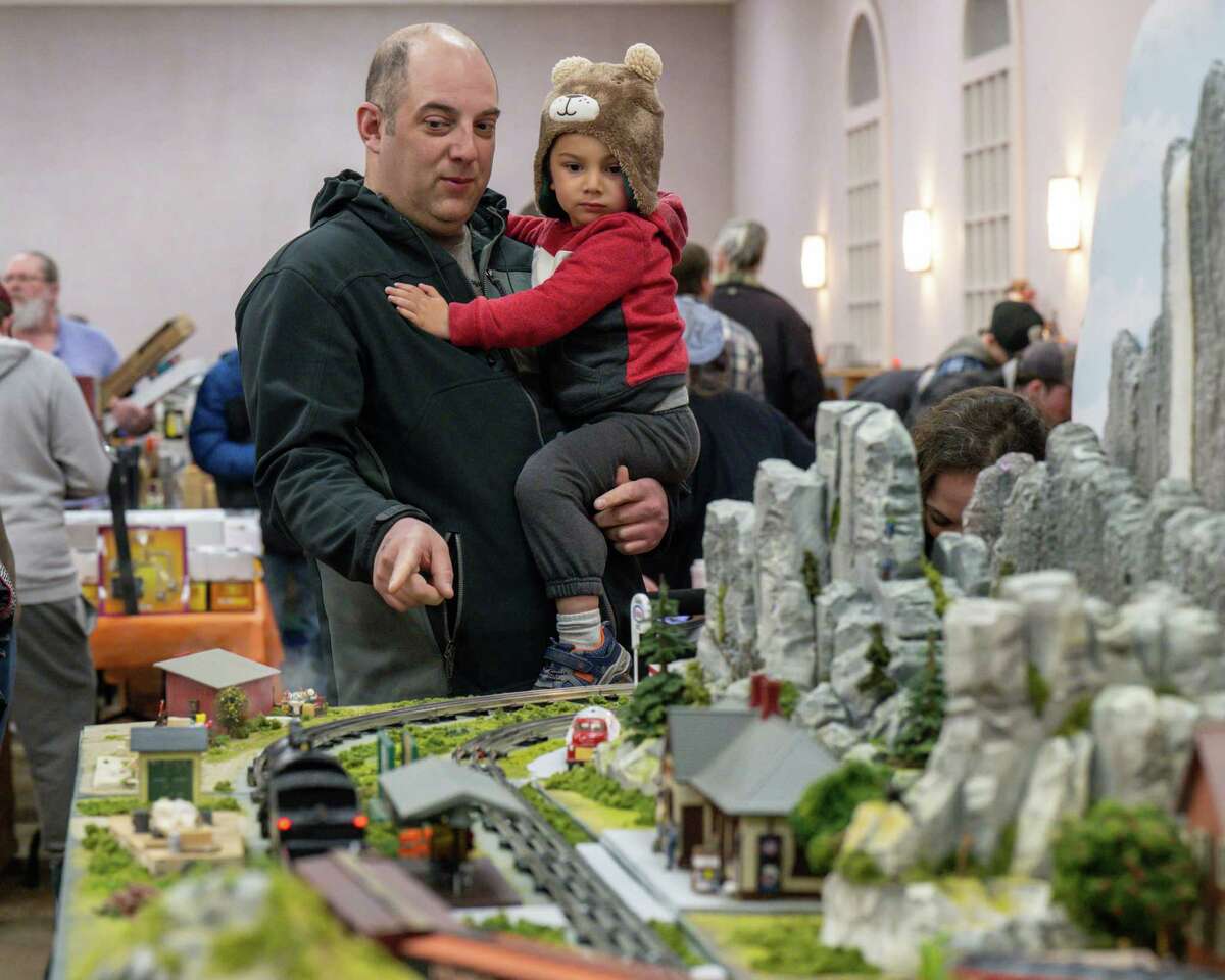 Nick and August Dykeman check out a model train at the Albany Train Show on Saturday, March 18, 2023, at the Polish Community Center in Albany, NY.