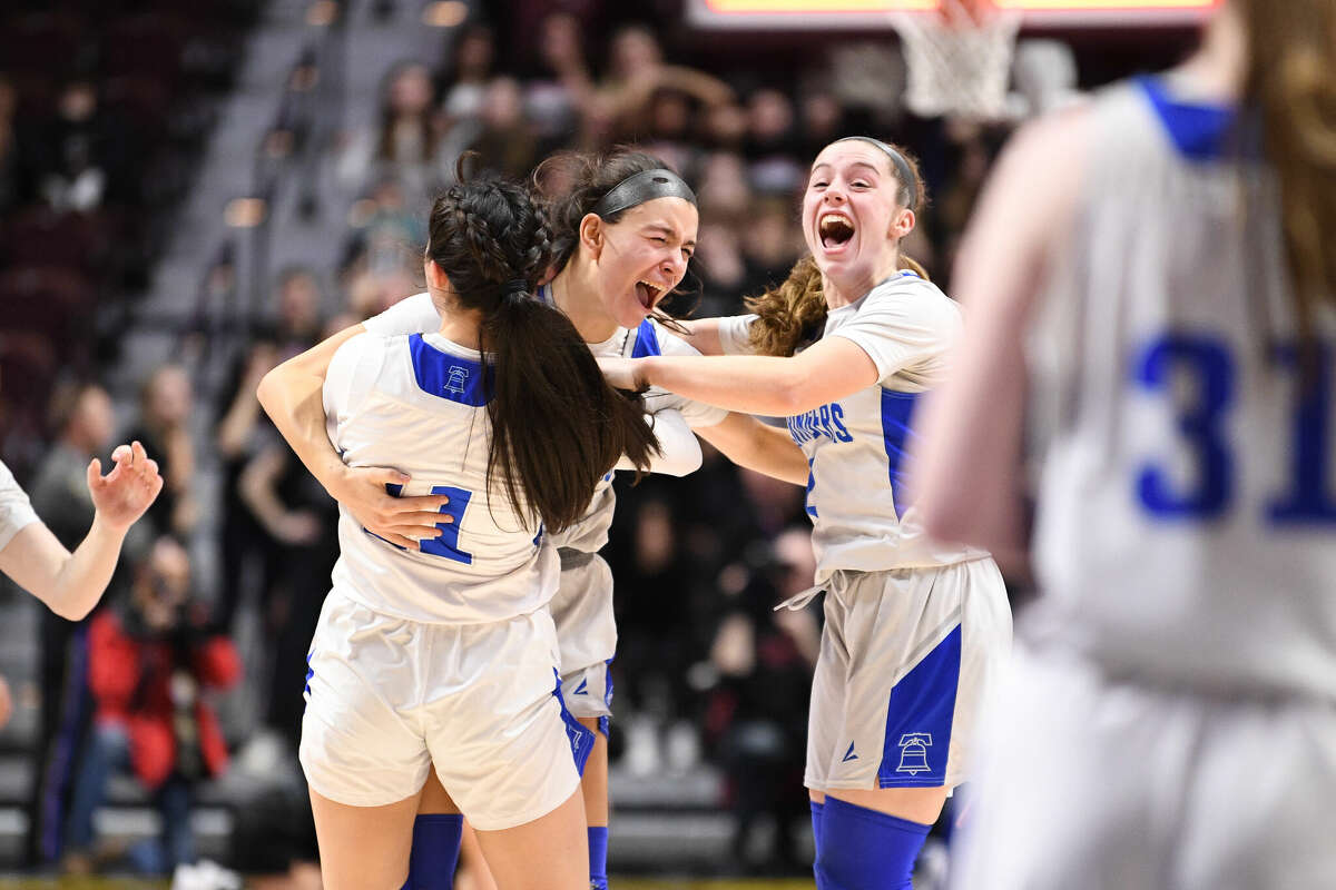 The East Hampton Bellringers celebrate winning the 2023 CIAC Class M Girls Basketball Championship at Mohegan Sun Arena, March 18, 2023