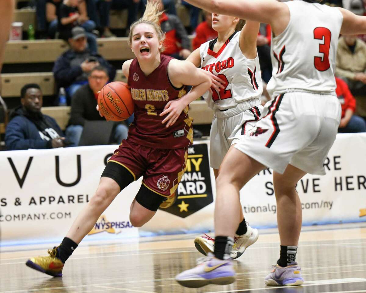 Notre Dame-Bishop Gibbons junior Angelina Deitz drives to the basket during the Class D state semifinals against Oxford Academy on Saturday, March 18, 2023, on the Hudson Valley Community College campus in Troy, NY.