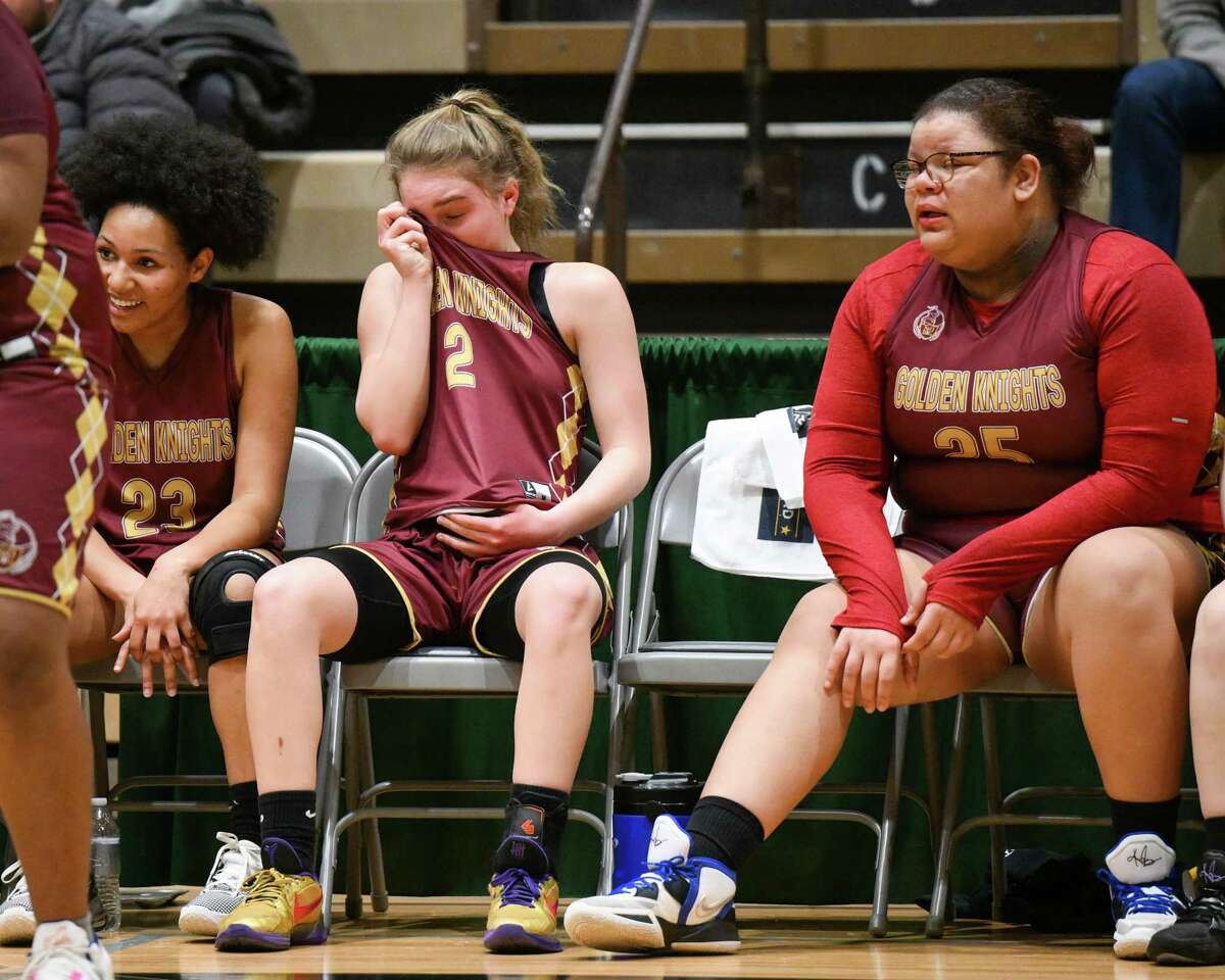 Notre Dame-Bishop Gibbons players react after losing the Class D state semifinals Oxford Academy on Saturday, March 18, 2023, on the Hudson Valley Community College campus in Troy, NY.