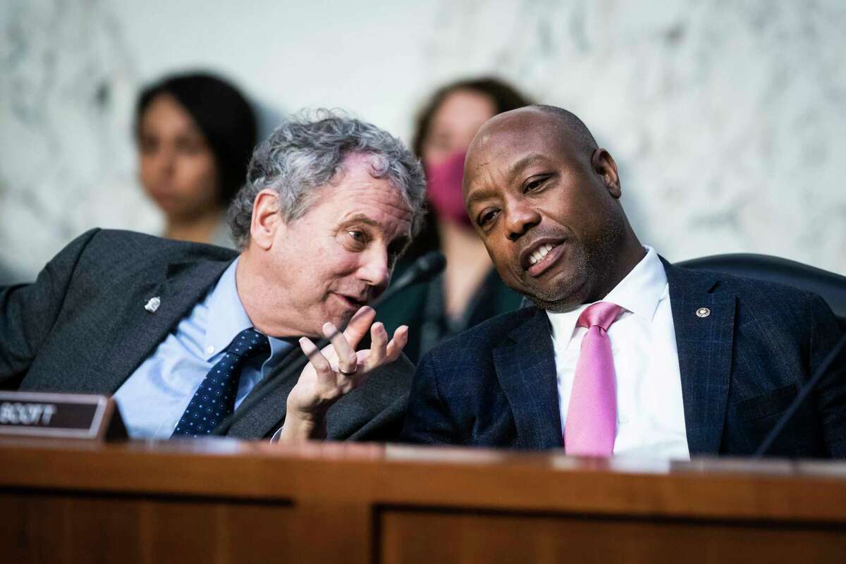 Senate Banking Committee Chairman Sherrod Brown (D-Ohio), left, with Sen. Tim Scott (R-S.C.), this month when the Federal Reserve Chairman Jerome H. Powell testified on Capitol Hill.