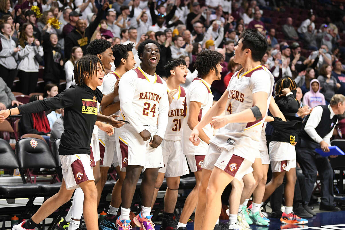 Windsor Locks high's bench celebrates during the CIAC Division V Finals at Mohegan Sun, March 18, 2023.