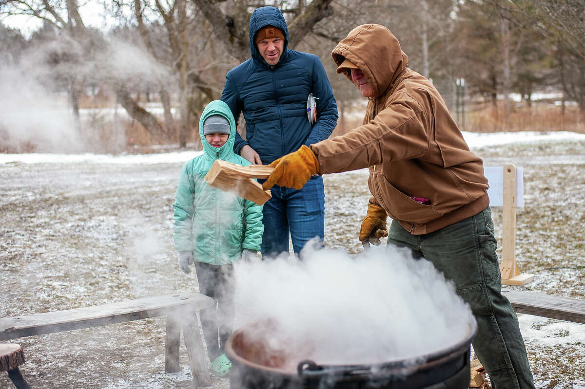 Chippewa Nature Center volunteer Phil Meister boils down sap to make syrup for Maple Syrup Day on March 18, 2023 at the Chippewa Nature Center in Midland. The method he was using dates back to the 1870s.