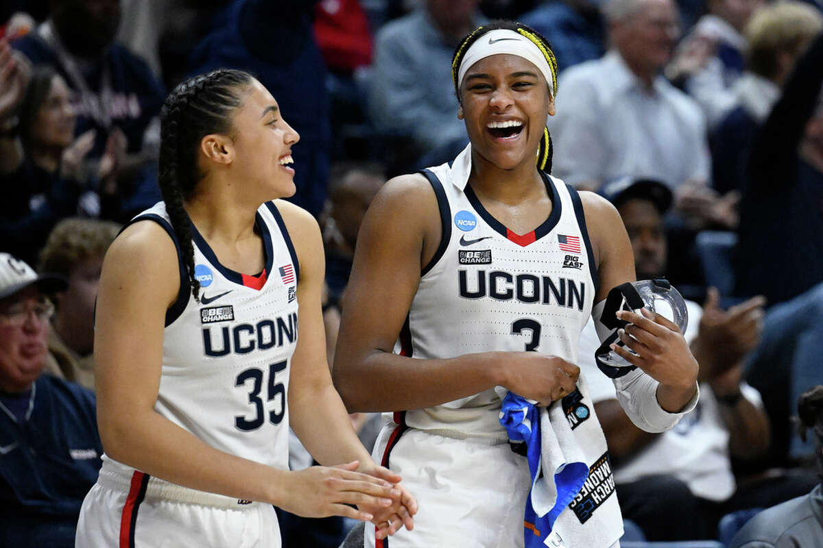 UConn's Aaliyah Edwards (3) celebrates with teammate Azzi Fudd (35) in the second half of a first-round college basketball game against Vermont in the NCAA Tournament, Saturday, March 18, 2023, in Storrs, Conn. (AP Photo/Jessica Hill)