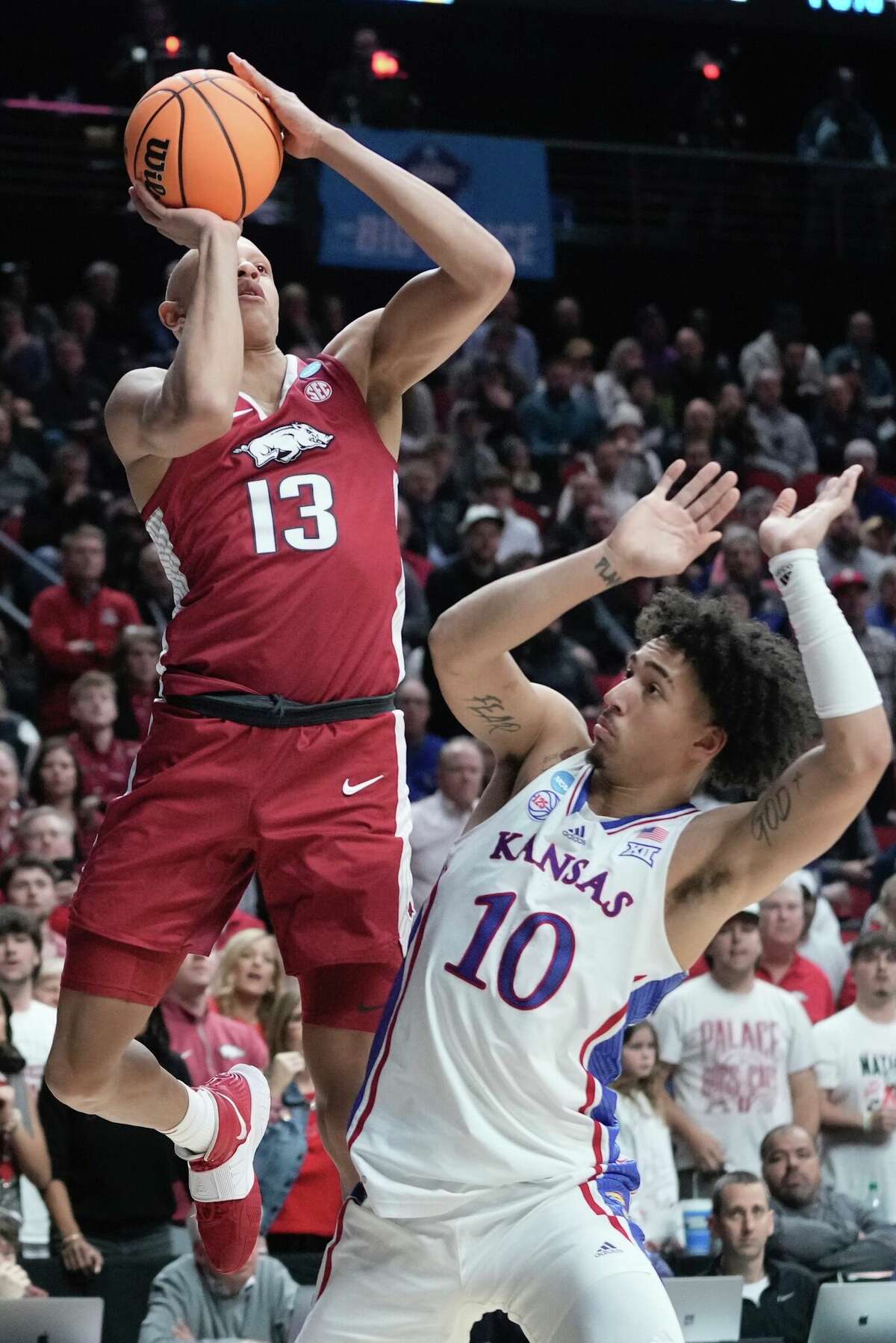 Upstart Arkansas knocks off topseed Kansas in NCAA Tournament