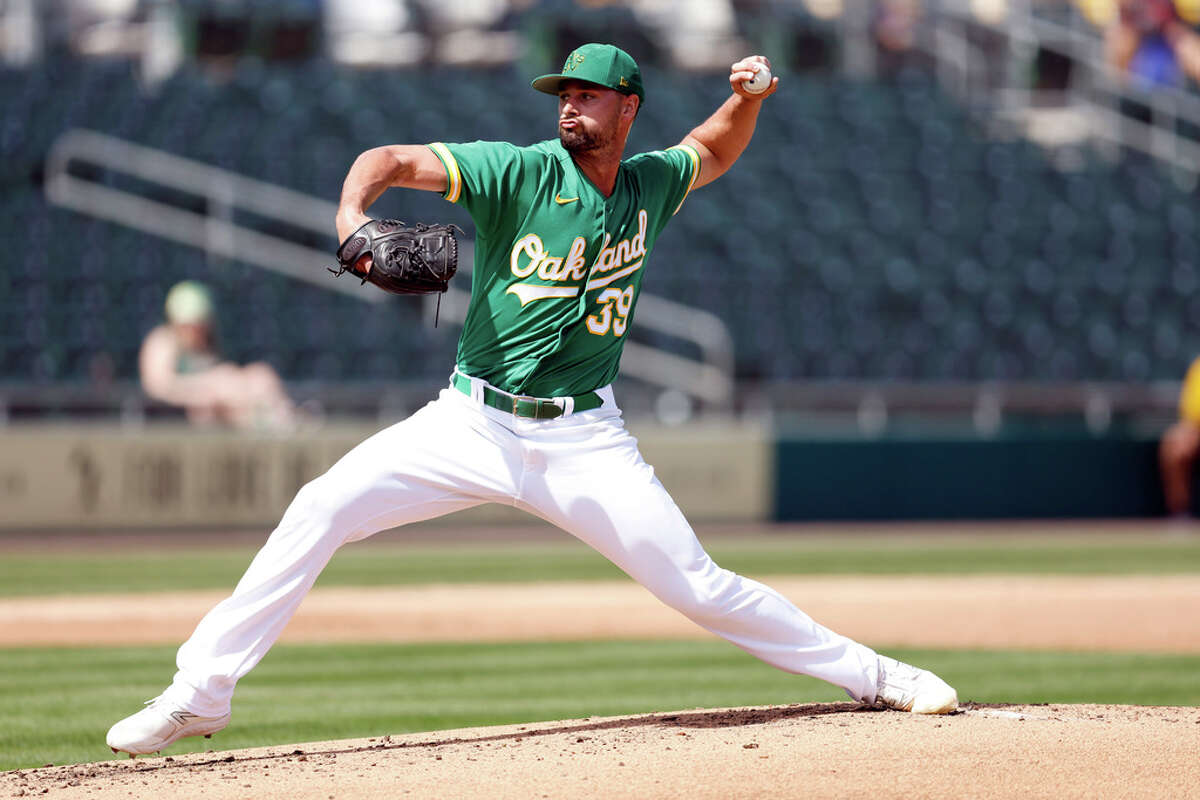 Oakland Athletics' Zach Jackson pitches against the Minnesota