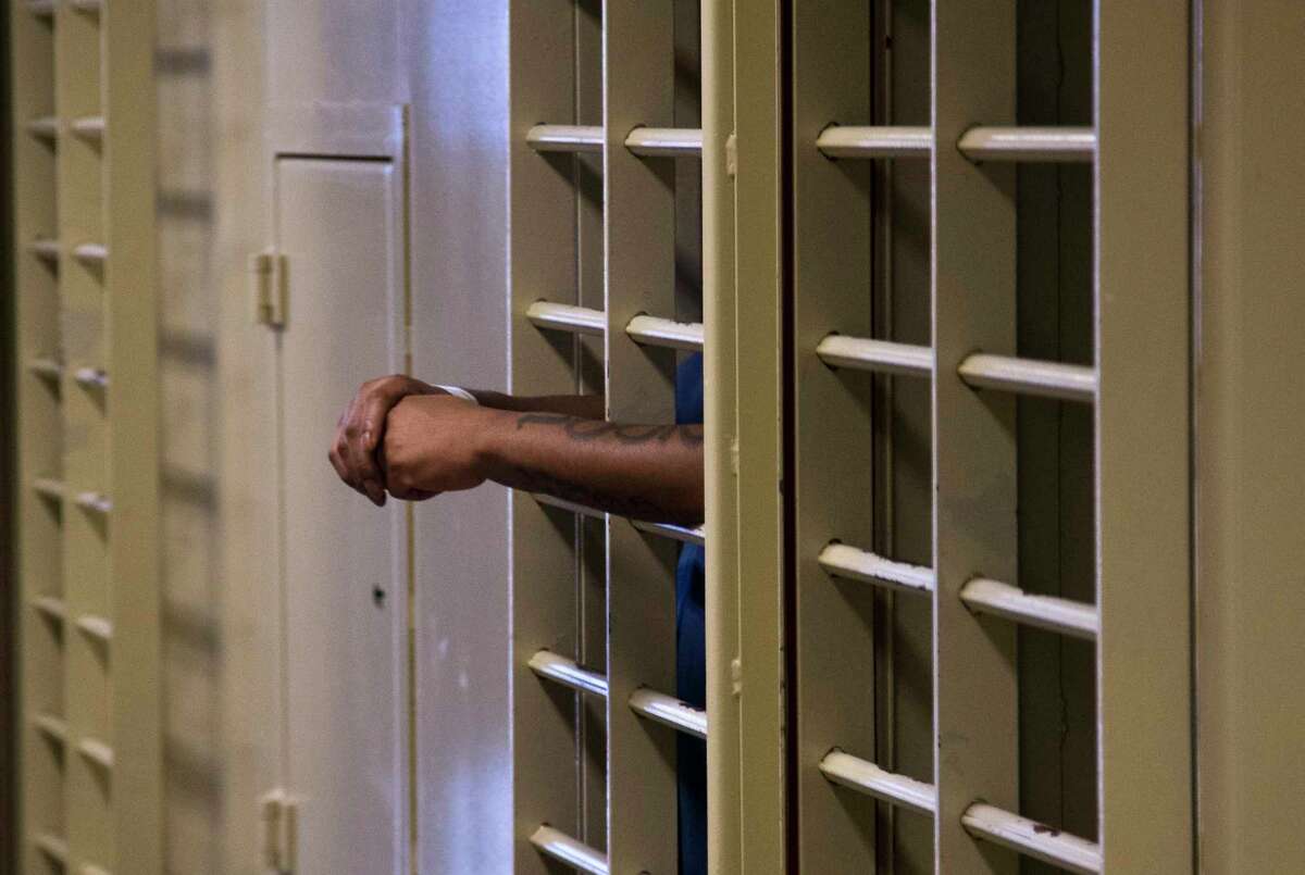 FILE - A prisoner stands inside an isolation cell at the Dane County Jail in Madison, Wis., Sept. 16, 2014. Republican lawmakers in Wisconsin and other states are pushing to increase the use of cash bail and pretrial detention.