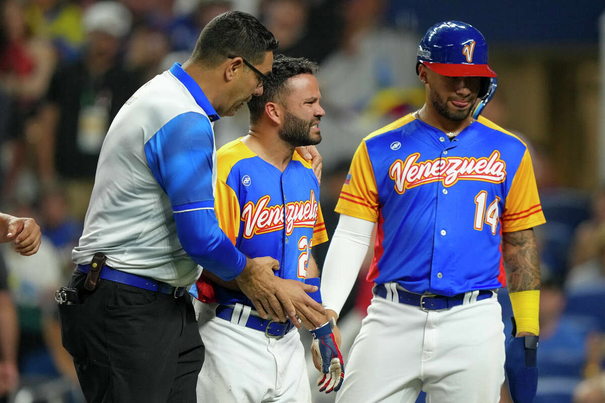 MIAMI, FLORIDA - MARCH 18: Jose Altuve #27 of Venezuela walks towards the dugout after being hit by a pitch during the fifth inning during a 2023 World Baseball Classic Quarterfinal game against the United States at loanDepot park on March 18, 2023 in Miami, Florida. (Photo by Eric Espada/Getty Images)