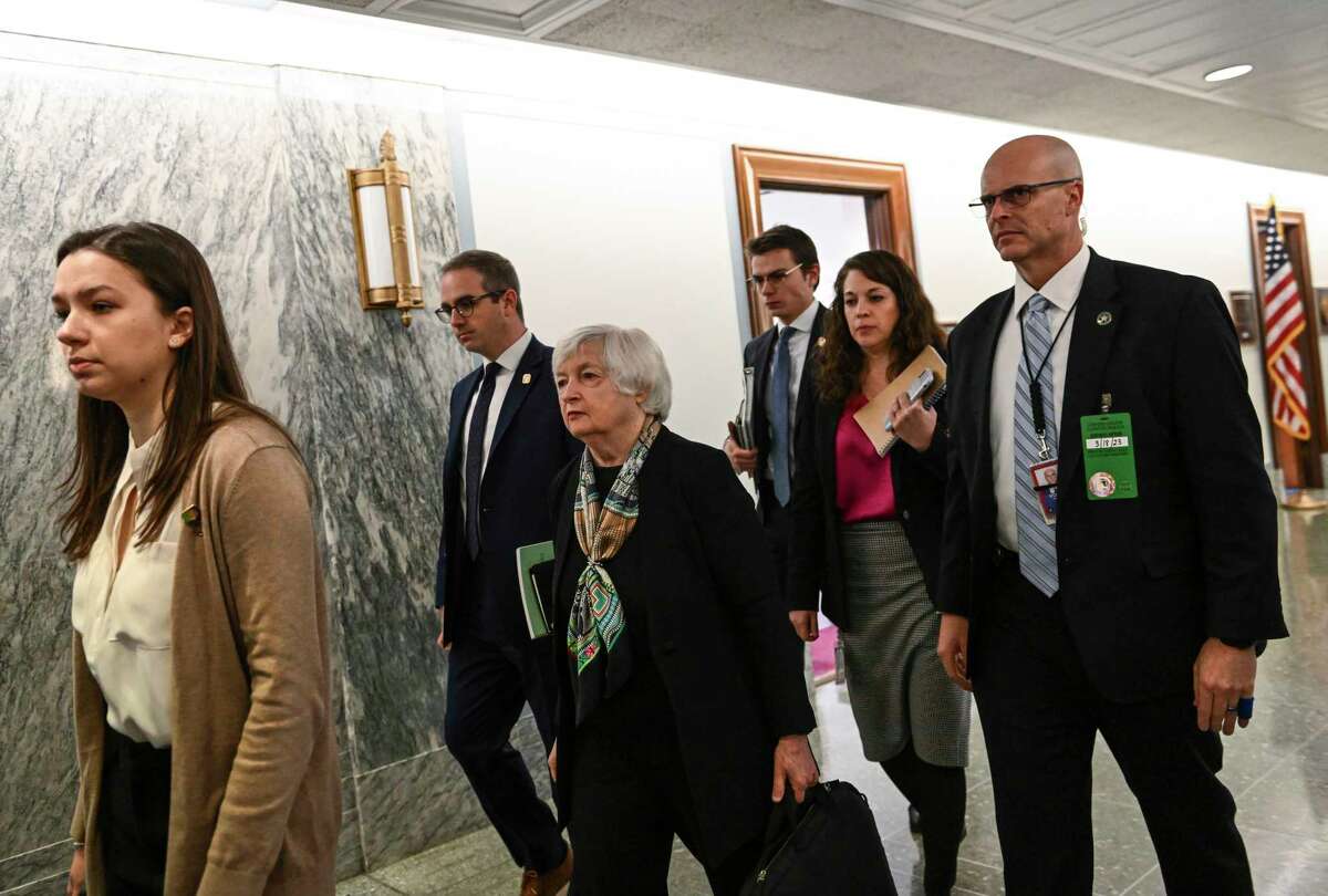 Treasury Secretary Janet L. Yellen, center, arrives to testify before the Senate Committee on Finance at the Dirksen Senate Office Building in Washington on March 16.