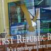 A television screen displaying financial news including the stock price of First Republic Bank is seen inside one of the bank's branches in the Financial District of Manhattan, Thursday, March 16, 2023. The S&P 500 was 0.8% higher in midday trading after erasing an earlier loss of nearly that much following reports that First Republic Bank could receive financial assistance or sell itself to another bank. (AP Photo/Mary Altaffer)