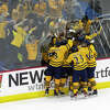 The Quinnipiac student section gets to celebrate the Bobcats' fifth goal with their players on Friday Feb. 17 2023.?.?