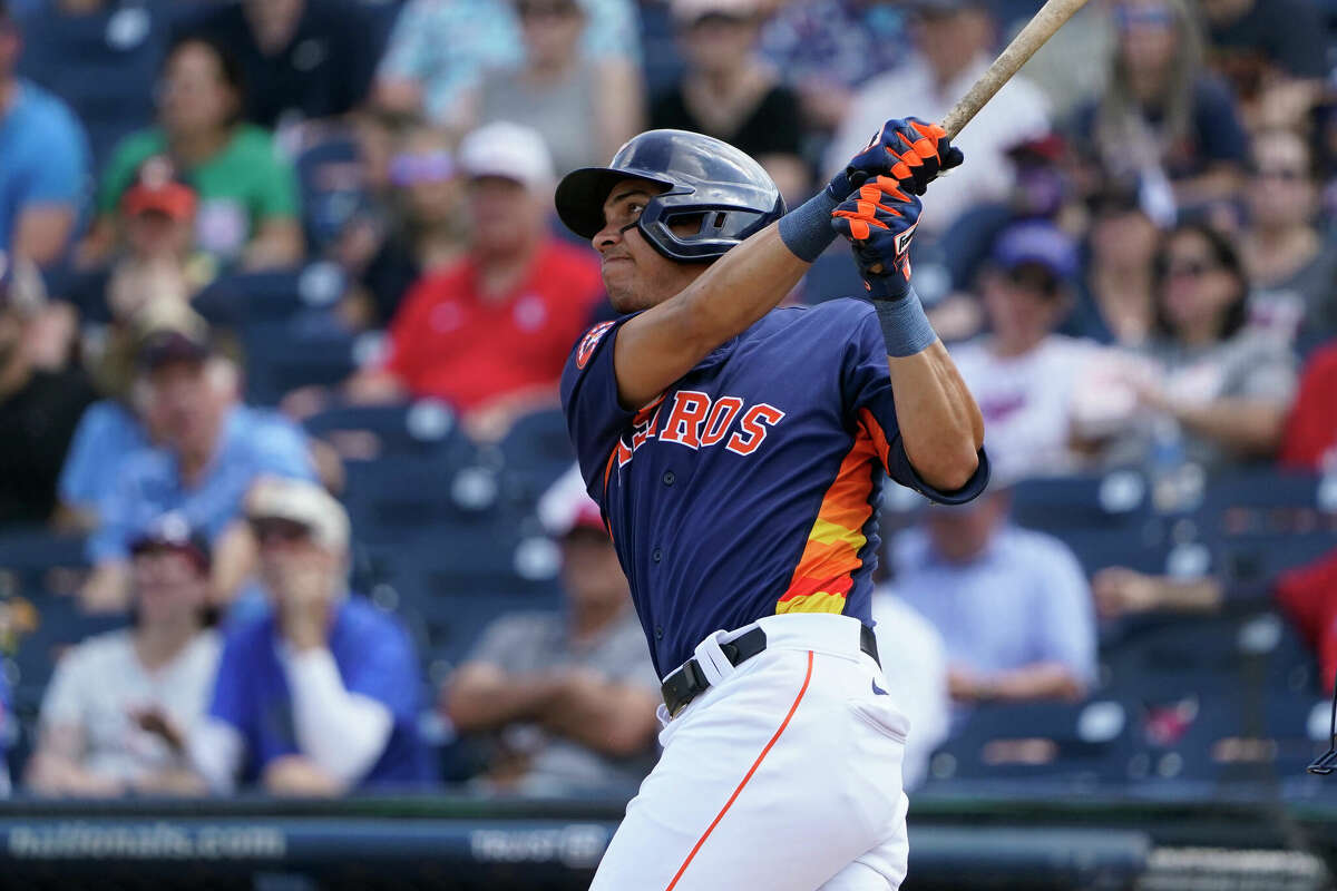 Houston Astros' Mauricio Dubon looks at his bat as he waits to hit