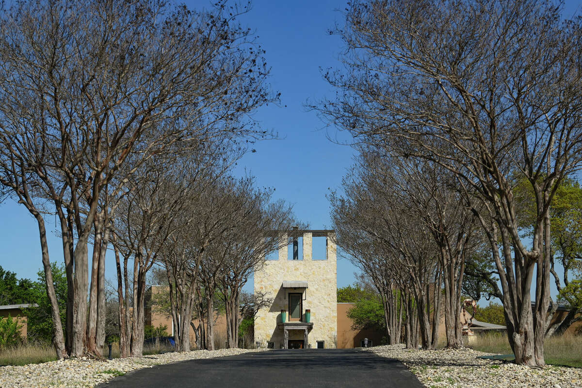 The approach to the house is dominated by the schmear limestone battlement visible from miles around. The design feature has earned the home the moniker the Comfort Castle.