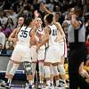 UConn players celebrate in the second half of a second-round college basketball game against Baylor in the NCAA Tournament, Monday, March 20, 2023, in Storrs, Conn.