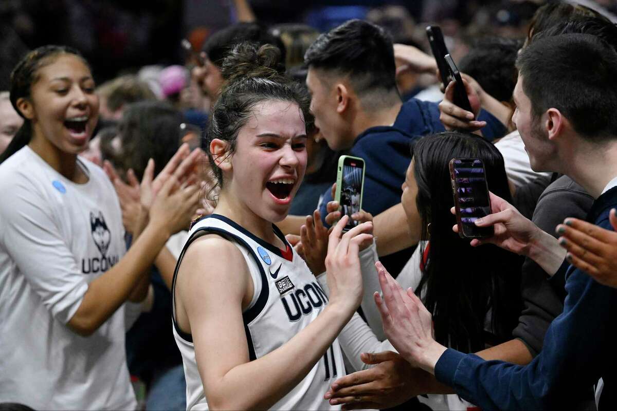 UConn's Lou Lopez Senechal (11) celebrates with students after her team's win over Baylor in a second-round college basketball game in the NCAA Tournament, Monday, March 20, 2023, in Storrs, Conn.