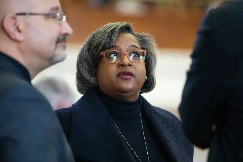 State Rep. Rhetta Andrews Bowers, D-Garland, speaks with colleagues in the House chamber in 2019.