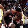 Houston Rockets' Tari Eason (17) battles Golden State Warriors' Draymond Green for a rebound during the first half of an NBA basketball game Monday, March 20, 2023, in Houston.