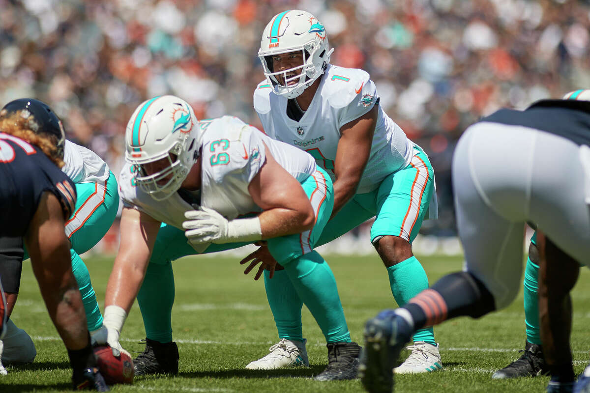 Miami Dolphins guard Michael Deiter (63) heads onto the field for