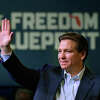 Florida Gov. Ron DeSantis waves to the crowd as he attends an event Friday, March 10, 2023, in Davenport, Iowa.  
