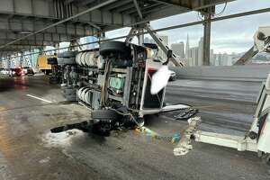 Big rig overturns on Bay Bridge, snarling commute for hours as storm pounds Bay Area