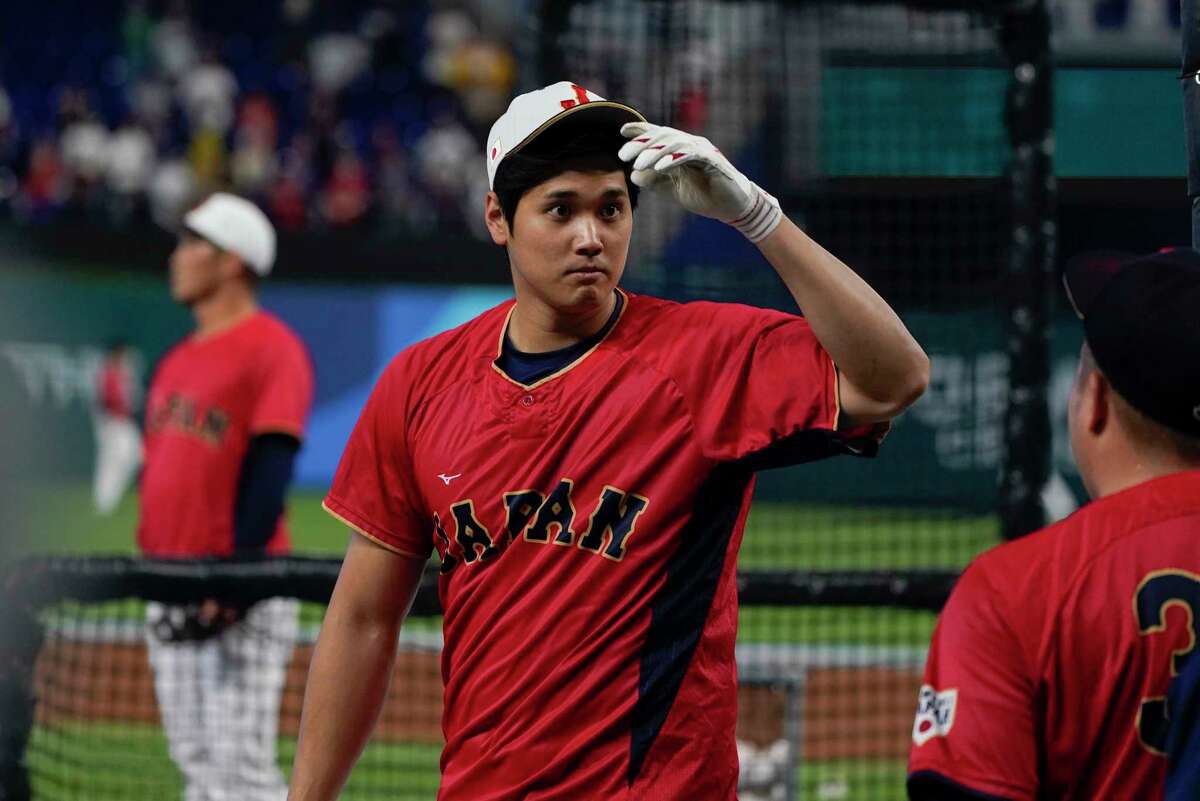 Japan player Shohei Ohtani warms up before the World Baseball Classic championship game against the United States, Tuesday, March 21, 2023, in Miami.