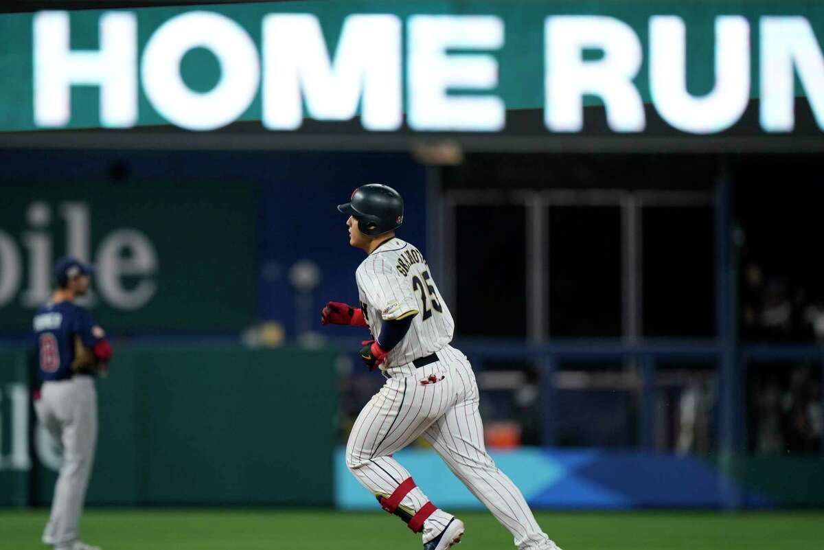 Japan's Kazuma Okamoto (25) runs bases after hitting a home run during fourth inning of a World Baseball Classic championship game, Tuesday, March 21, 2023, in Miami.