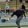 Robert Plunkett plays pickleball at Cherry Lawn Park in Darien, Conn., on Saturday March 22, 2023. Due to high demand, Darien is restricting the pickleball courts at Cherry Lawn Park to residents and their guests only and testing out a new court reservation system this spring.