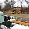 A view of construction materials and vehicles staged in the empty lot next to Colonial Village off of West Cedar Street in Norwalk, Conn., on Wednesday March 22, 2023. This is the future site of Oak Grove Apartments and Learning Center, a project that will receive a $1.8 million grant from the state's Community Investment Fund 2030. It will have 69 mixed-income affordable apartments and a learning center for kids at Oak Grove and Colonial Village, the 200-unit development next door.