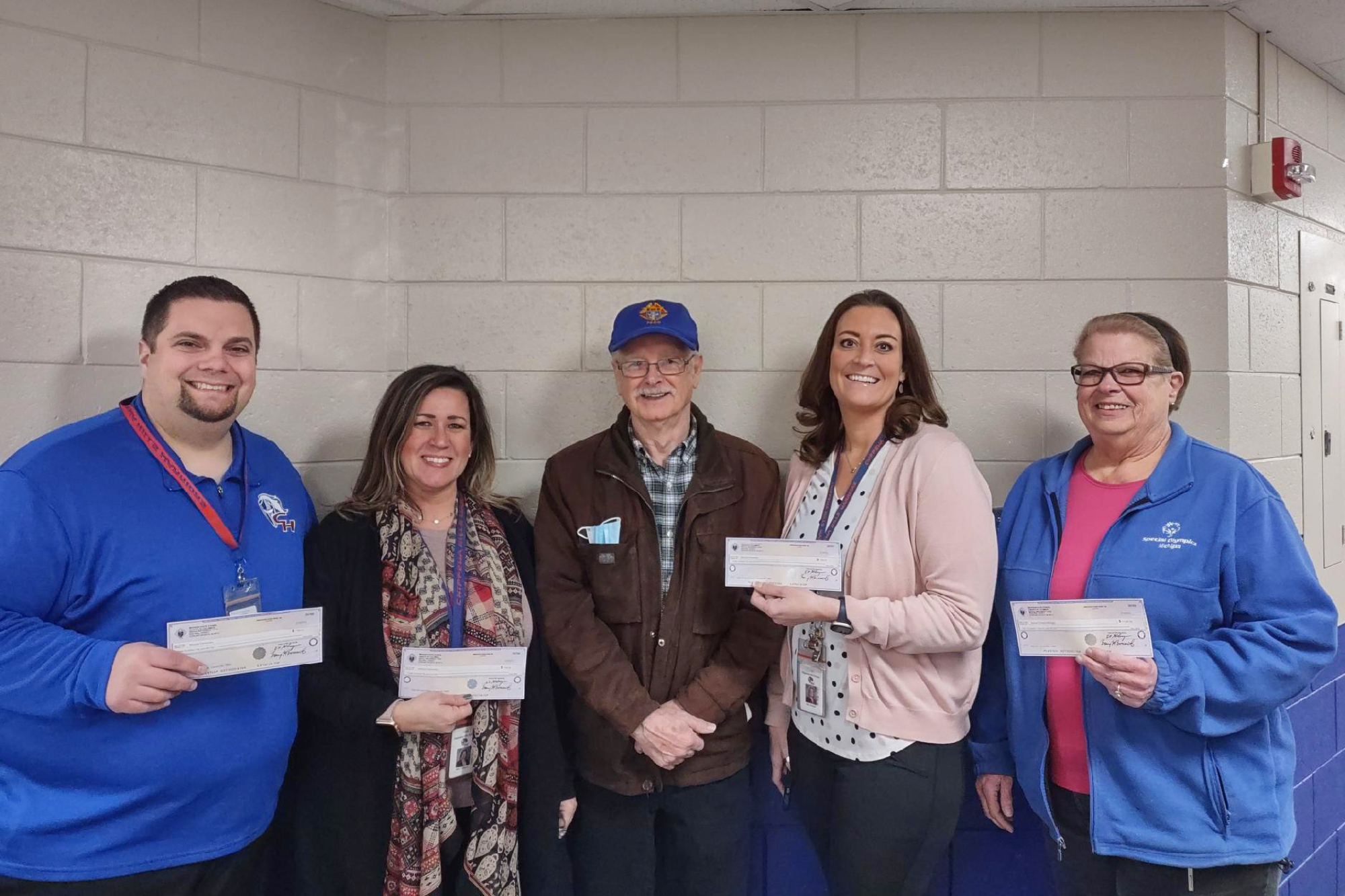 Knights of Columbus Remus gives out checks from Tootsie Roll Drive