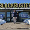 In this Monday, March 11, 2019, photo, Sandi Harding, general manager of the last Blockbuster on the planet in Bend, Ore., poses for a photo outside the store. When a Blockbuster in Perth, Australia, shuts its doors for the last time on March 31, the store in Bend will be the only one left on Earth. (AP Photo/Gillian Flaccus)